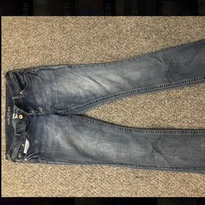 Faded boot cut jeans.